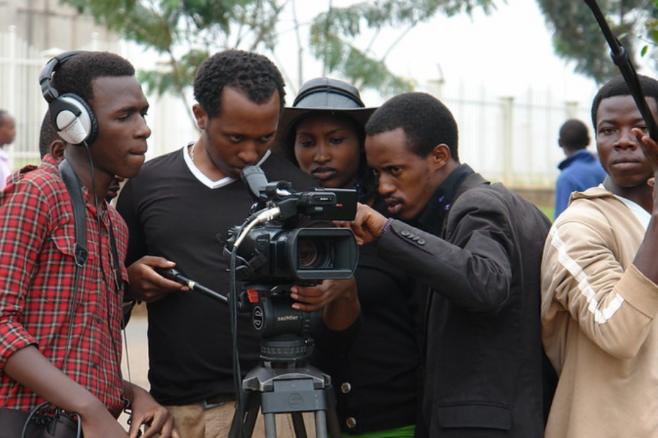 Four man filming on a camera