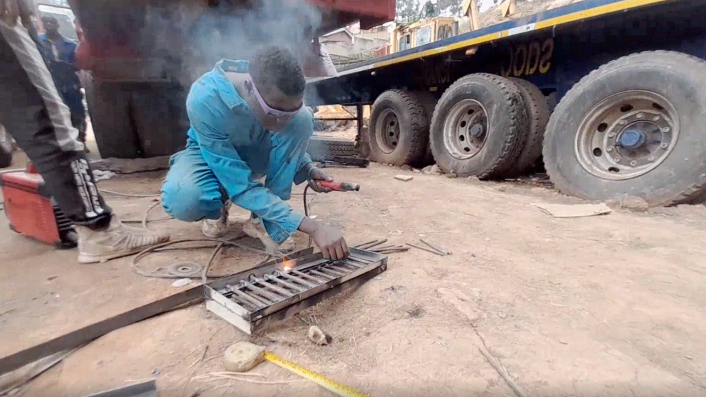 A man working with iron. 