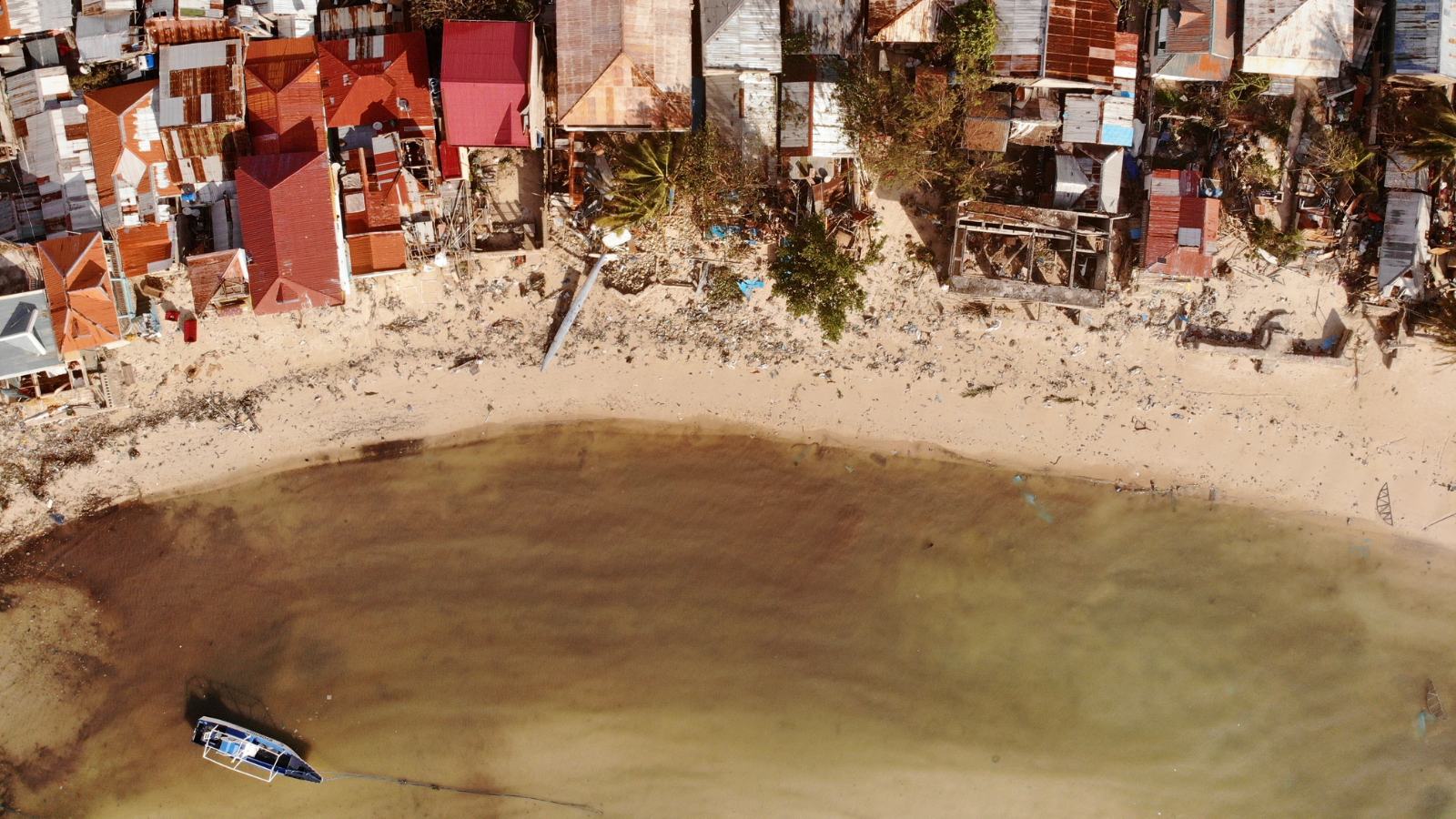 Drone's view the day of an island's coast after a typhoon hit