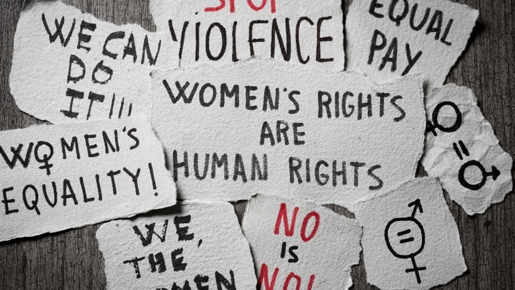 Pieces of paper with concepts related to women's rights written in them