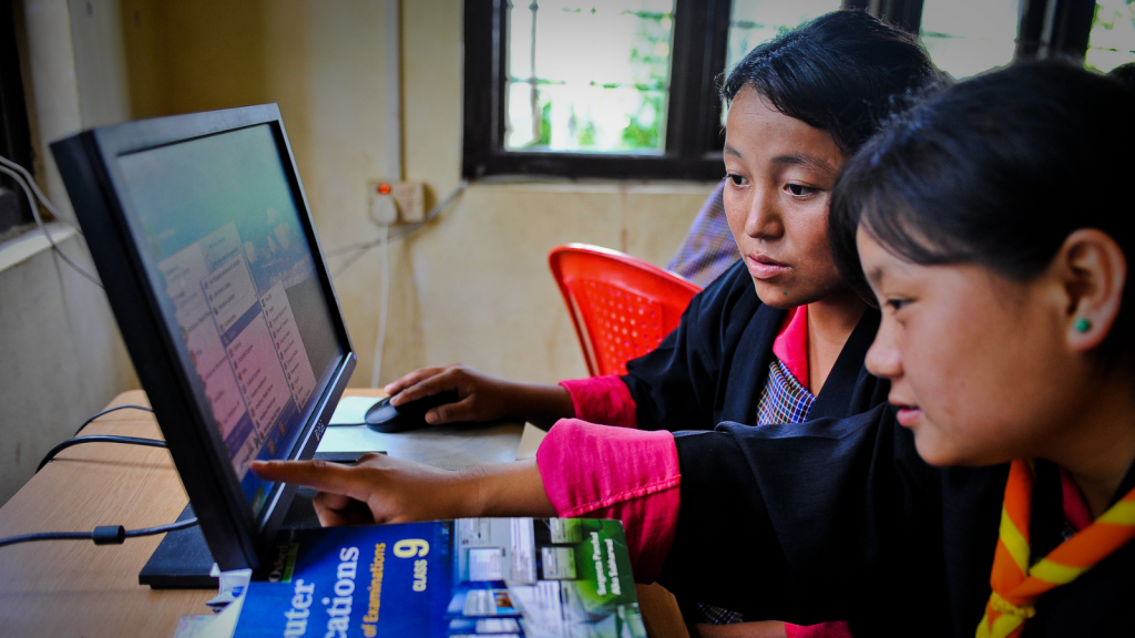 Students do practical computer exercises at the community e-Center in Bhutan. 