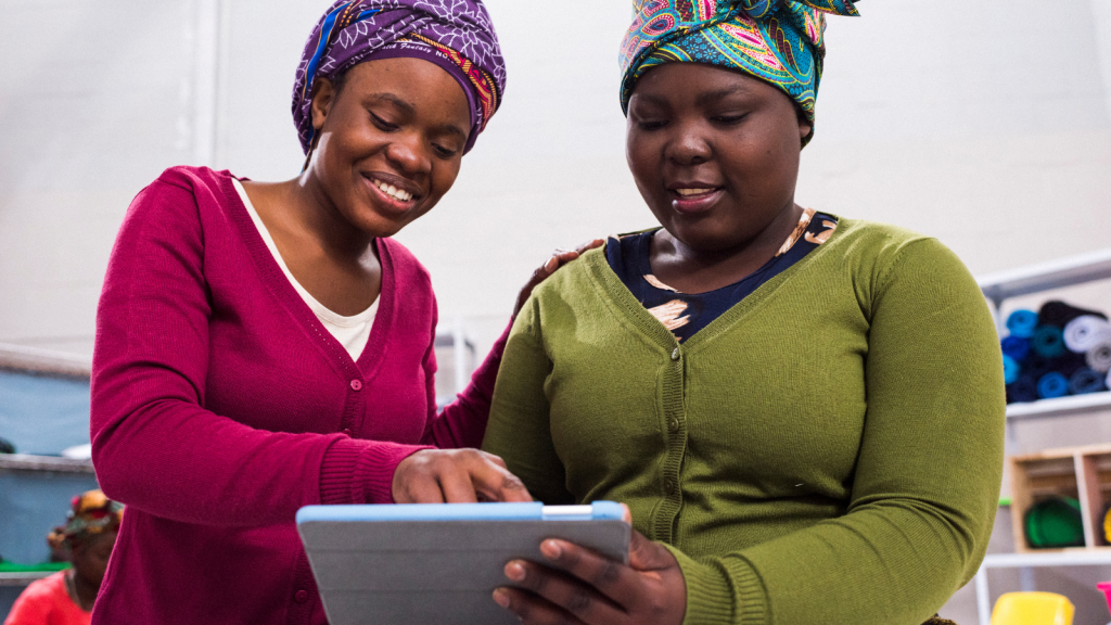 Two women ordering new inventory on their tablet computer